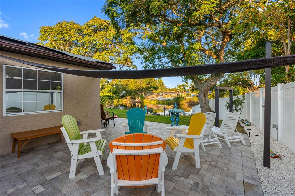 8139 129th Lane Seminole, FL 33776 - Photo 36 of 48 a view of a chairs and table in patio with a small yard