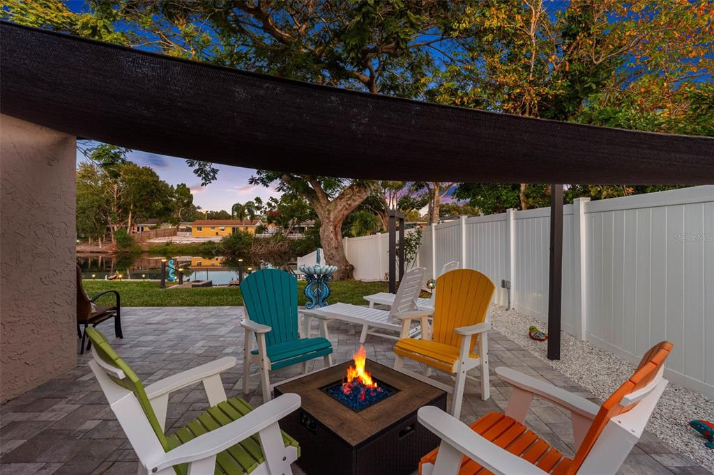 8139 129th Lane Seminole, FL 33776 - Photo 38 of 48 a backyard of a house with outdoor seating