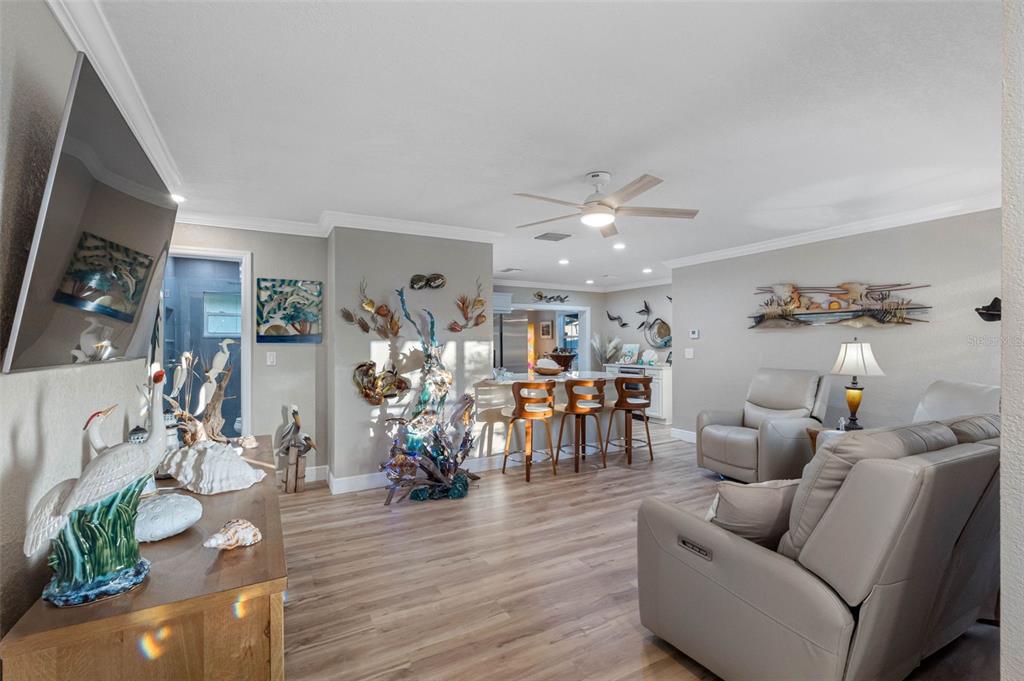 8139 129th Lane Seminole, FL 33776 - Photo 4 of 48 a living room with furniture and wooden floor