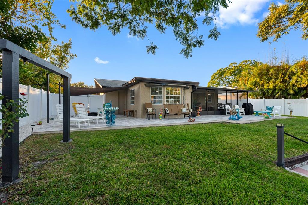 8139 129th Lane Seminole, FL 33776 - Photo 42 of 48 a front view of a house with garden