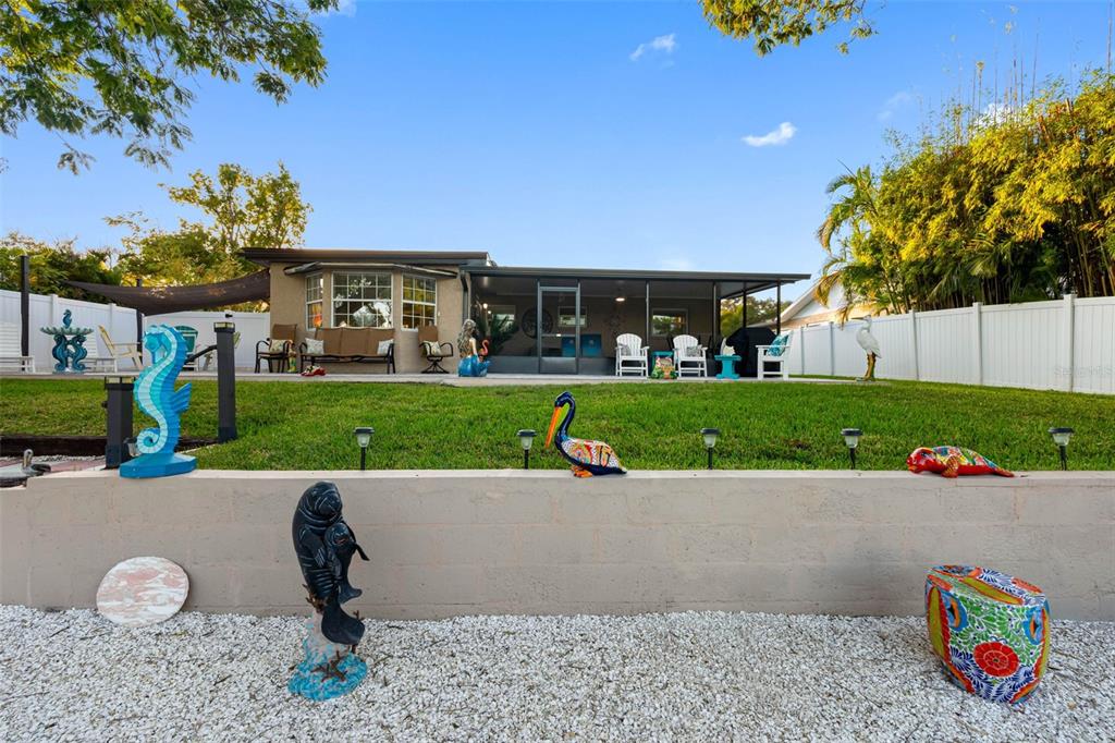8139 129th Lane Seminole, FL 33776 - Photo 43 of 48 a view of a backyard with plants and patio