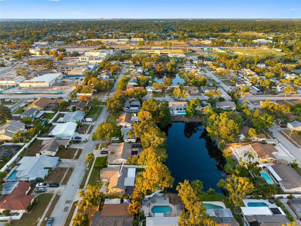 8139 129th Lane Seminole, FL 33776 - Photo 44 of 48 an aerial view of residential houses with outdoor space