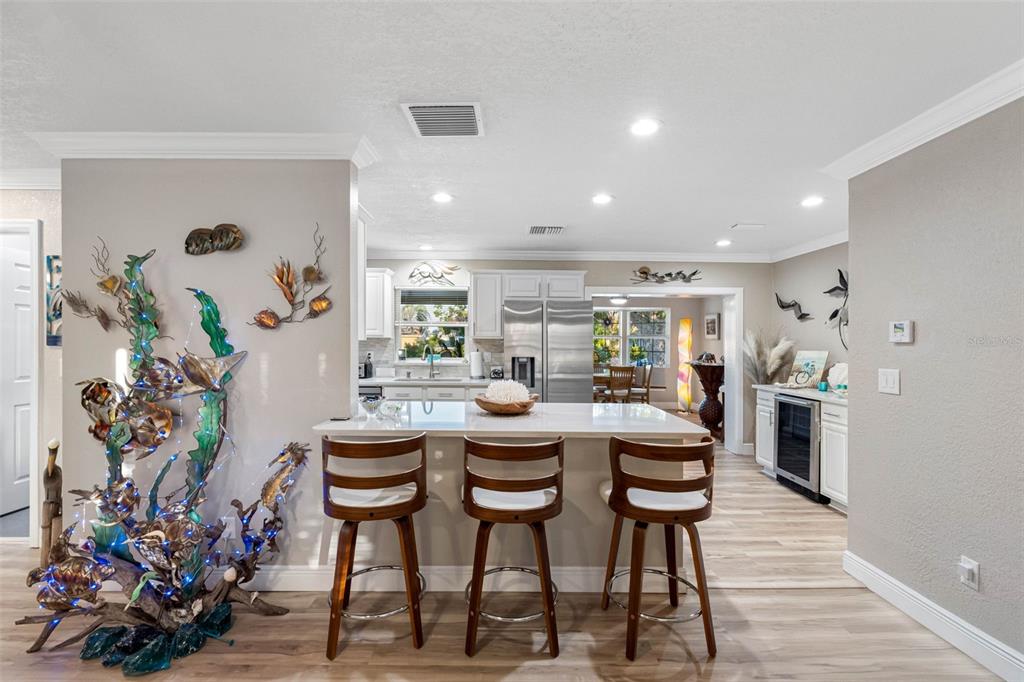8139 129th Lane Seminole, FL 33776 - Photo 5 of 48 a view of a dining room with furniture and wooden floor