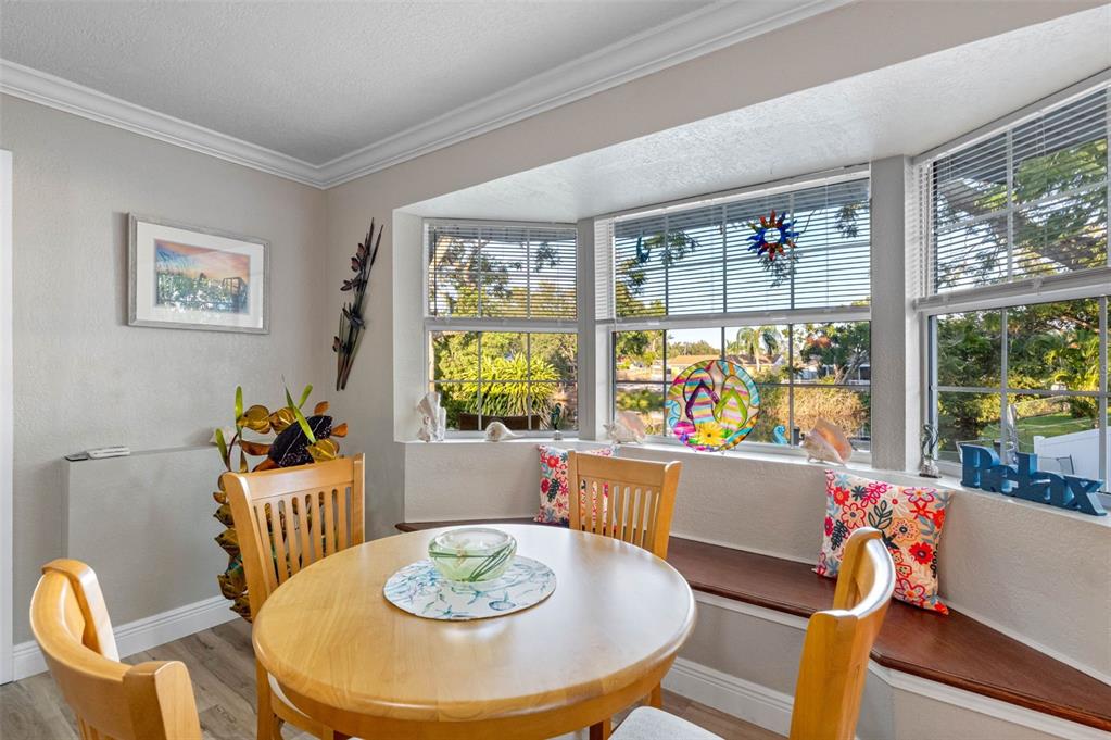 8139 129th Lane Seminole, FL 33776 - Photo 9 of 48 a living room with furniture and a table