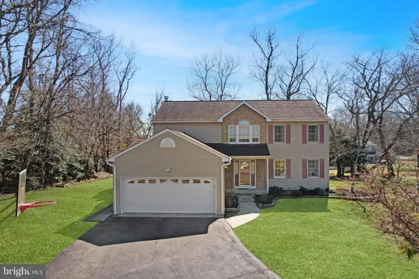 an aerial view of a house with outdoor space
