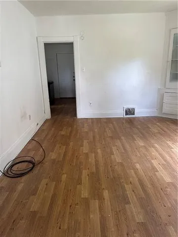 a view of a livingroom with wooden floor