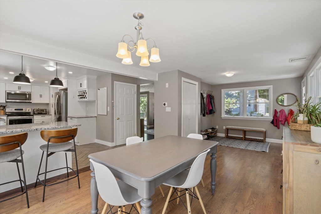 26 Miller Road Easton, MA 02356 - Photo 11 of 29 a view of a dining room with furniture and a chandelier