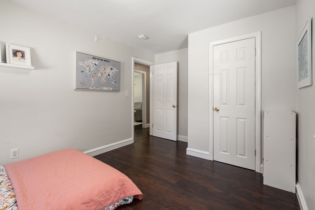 26 Miller Road Easton, MA 02356 - Photo 17 of 29 a bedroom with a bed and wooden floor