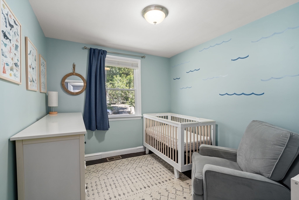 26 Miller Road Easton, MA 02356 - Photo 18 of 29 a bedroom with a bed and a window