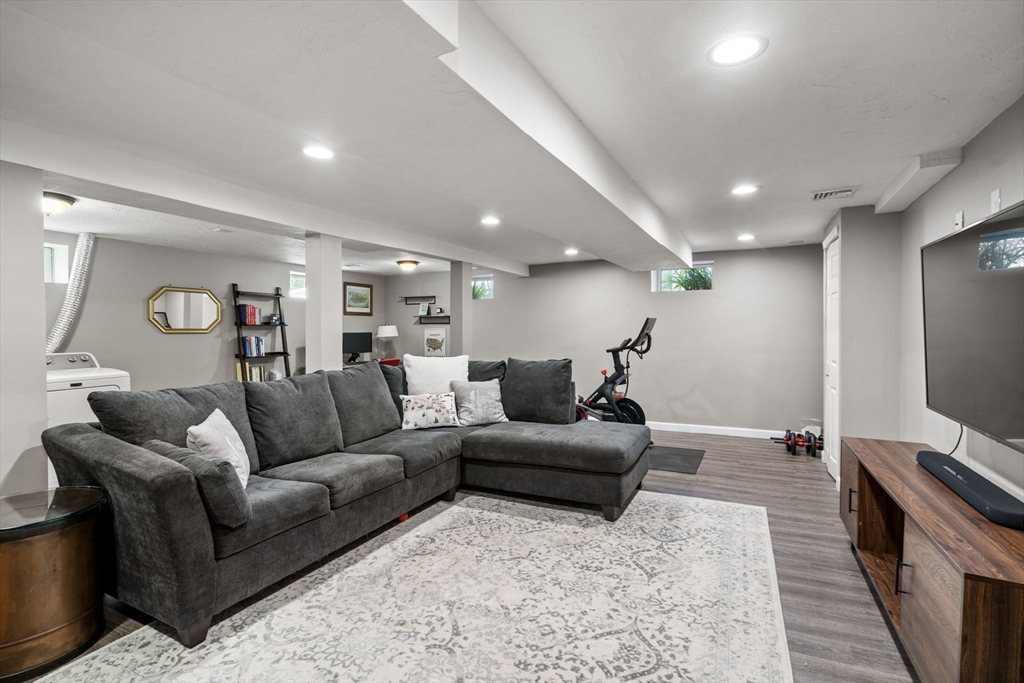 26 Miller Road Easton, MA 02356 - Photo 20 of 29 a living room with furniture and a flat screen tv