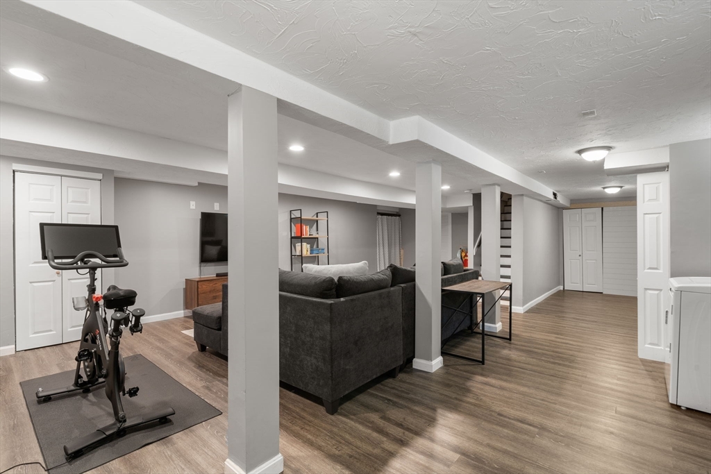 26 Miller Road Easton, MA 02356 - Photo 21 of 29 a living room with furniture and a flat screen tv