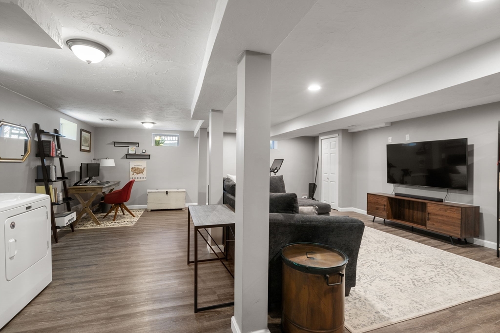 26 Miller Road Easton, MA 02356 - Photo 22 of 29 a living room with furniture and a flat screen tv