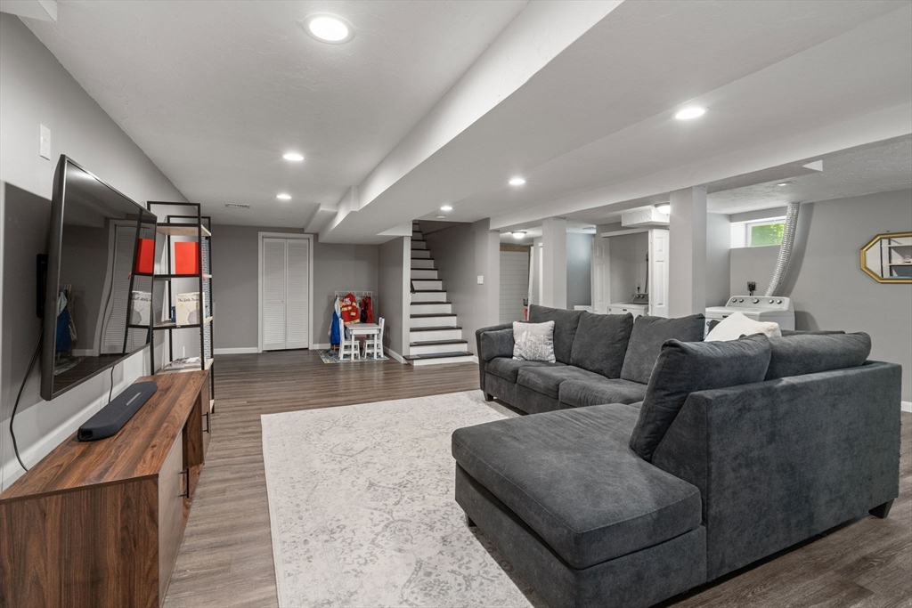 26 Miller Road Easton, MA 02356 - Photo 23 of 29 a living room with furniture and a flat screen tv