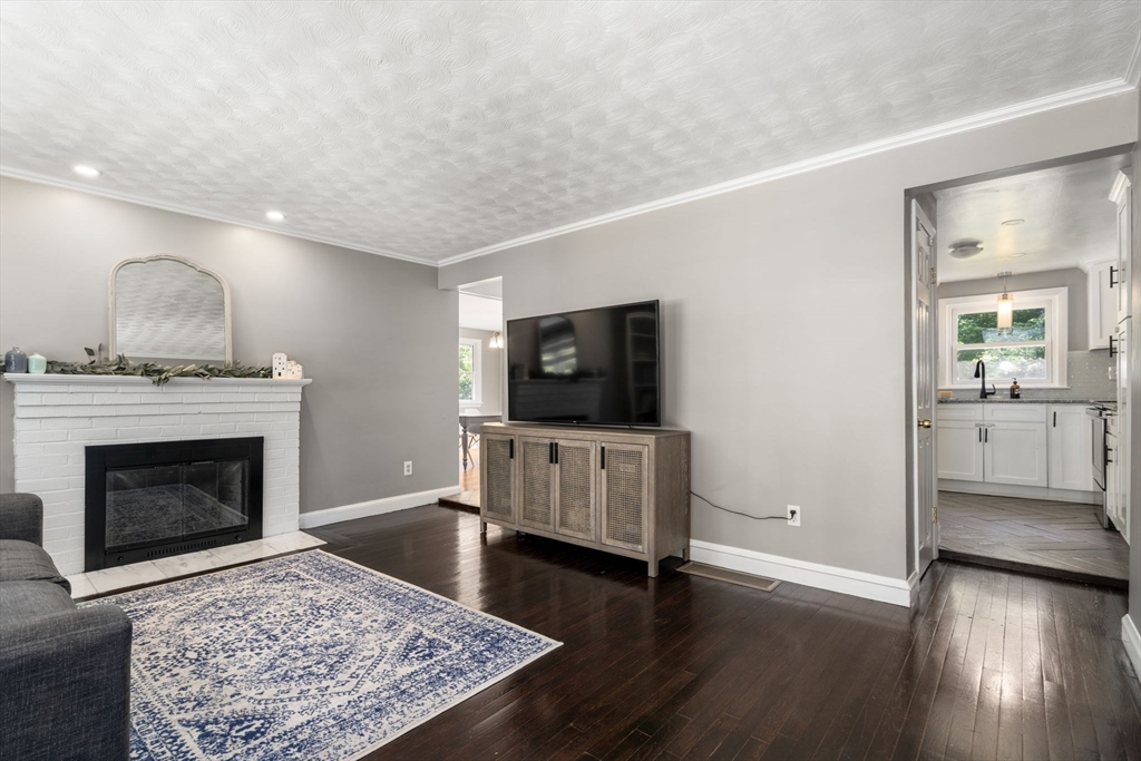 26 Miller Road Easton, MA 02356 - Photo 5 of 29 a living room with furniture and a fireplace