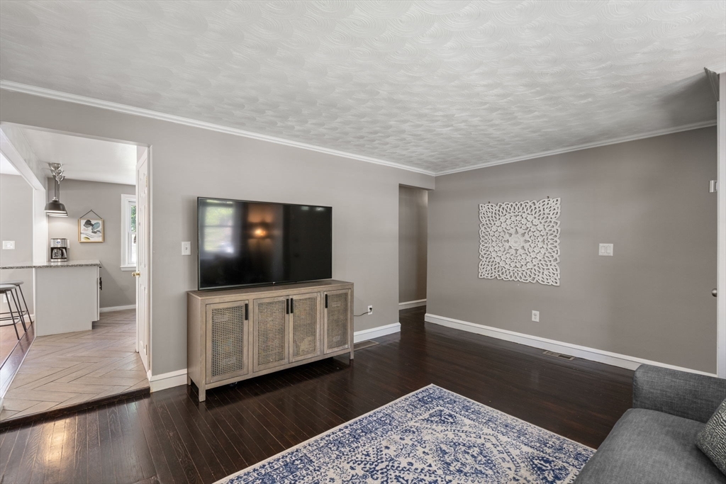 26 Miller Road Easton, MA 02356 - Photo 6 of 29 a living room with furniture and a flat screen tv
