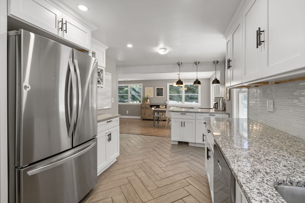 26 Miller Road Easton, MA 02356 - Photo 8 of 29 a kitchen with stainless steel appliances granite countertop a refrigerator and a stove