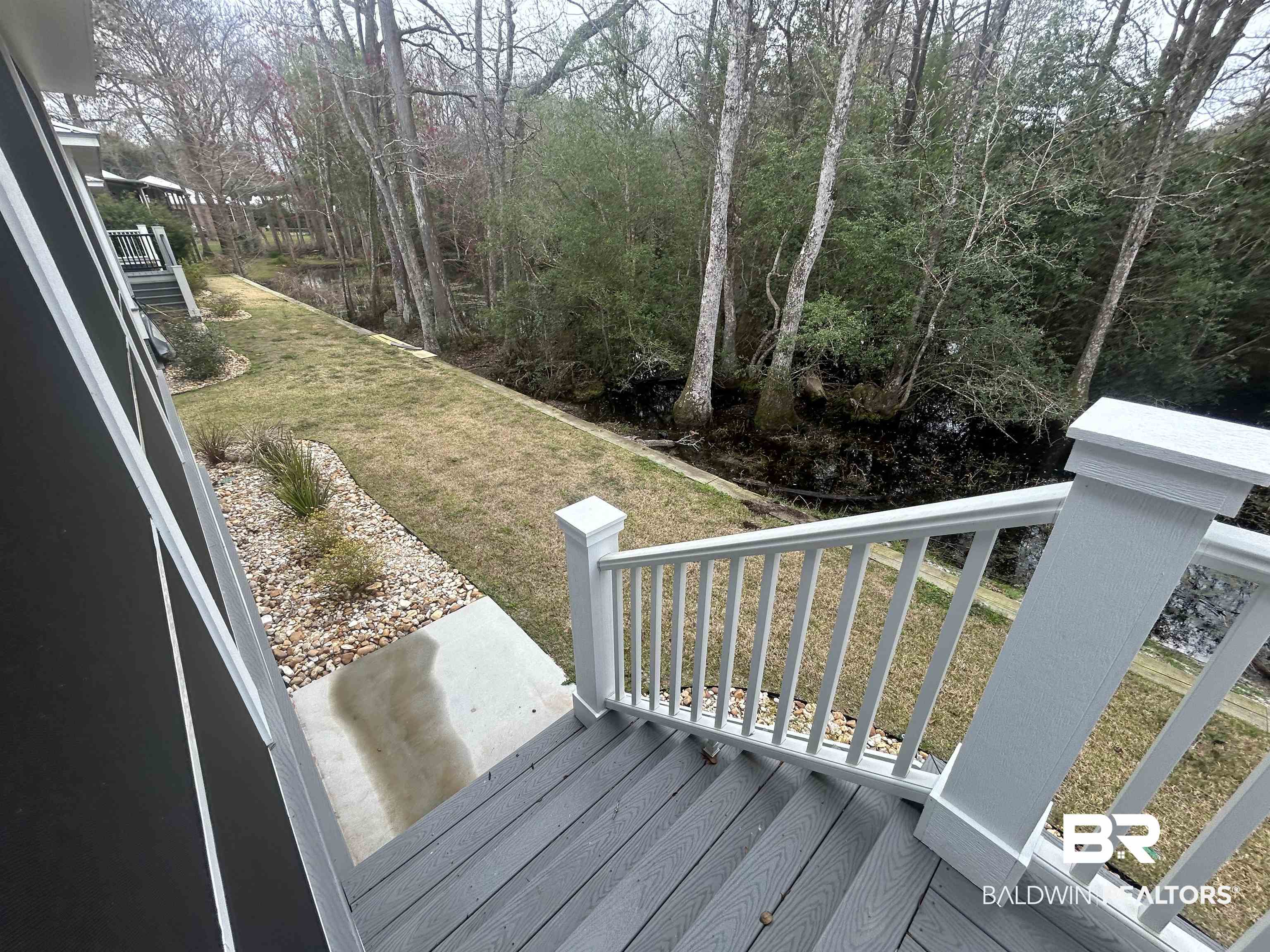 5122 Pine Road Orange Beach, AL 36561 - Photo 8 of 24 Wooden terrace with a lawn