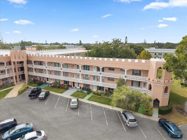 a view of a patio with table and chairs and potted plants