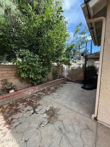 a view of a pathway both side of the house