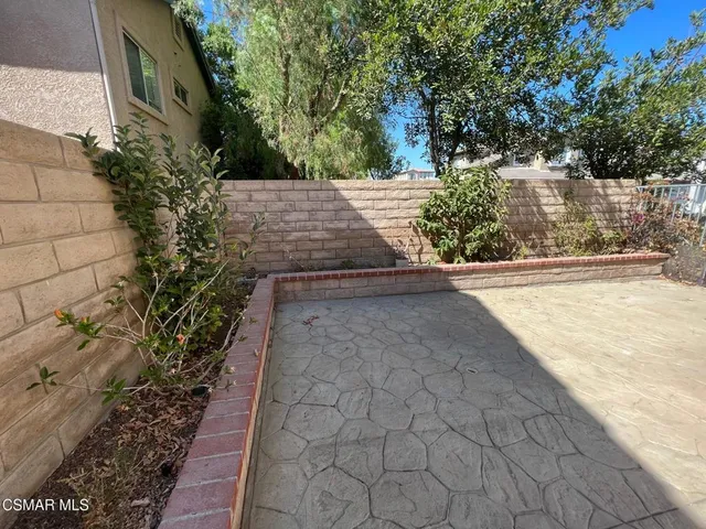 a view of a swimming pool and a chair