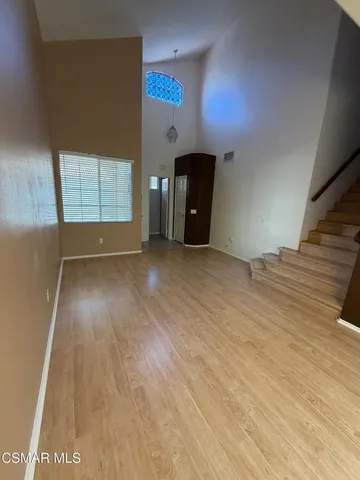 a view of an empty room with a window