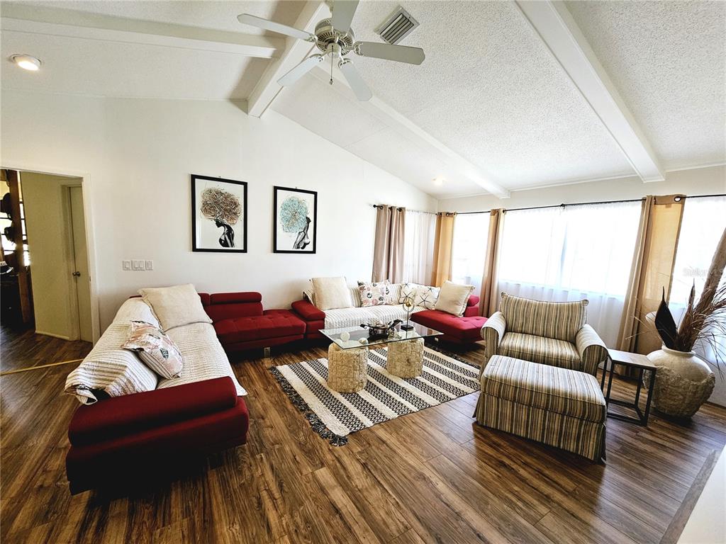 2411 Belle Road Englewood, FL 34223 - Photo 12 of 30 a living room with furniture and a large window