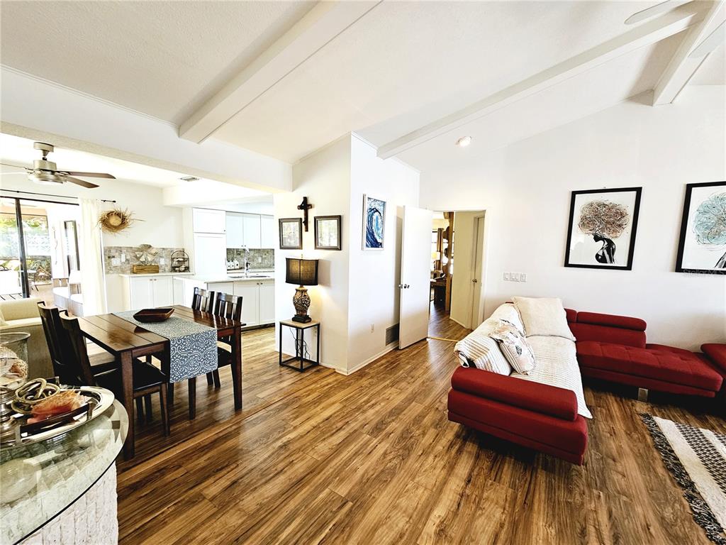 2411 Belle Road Englewood, FL 34223 - Photo 13 of 30 a living room with furniture and wooden floor