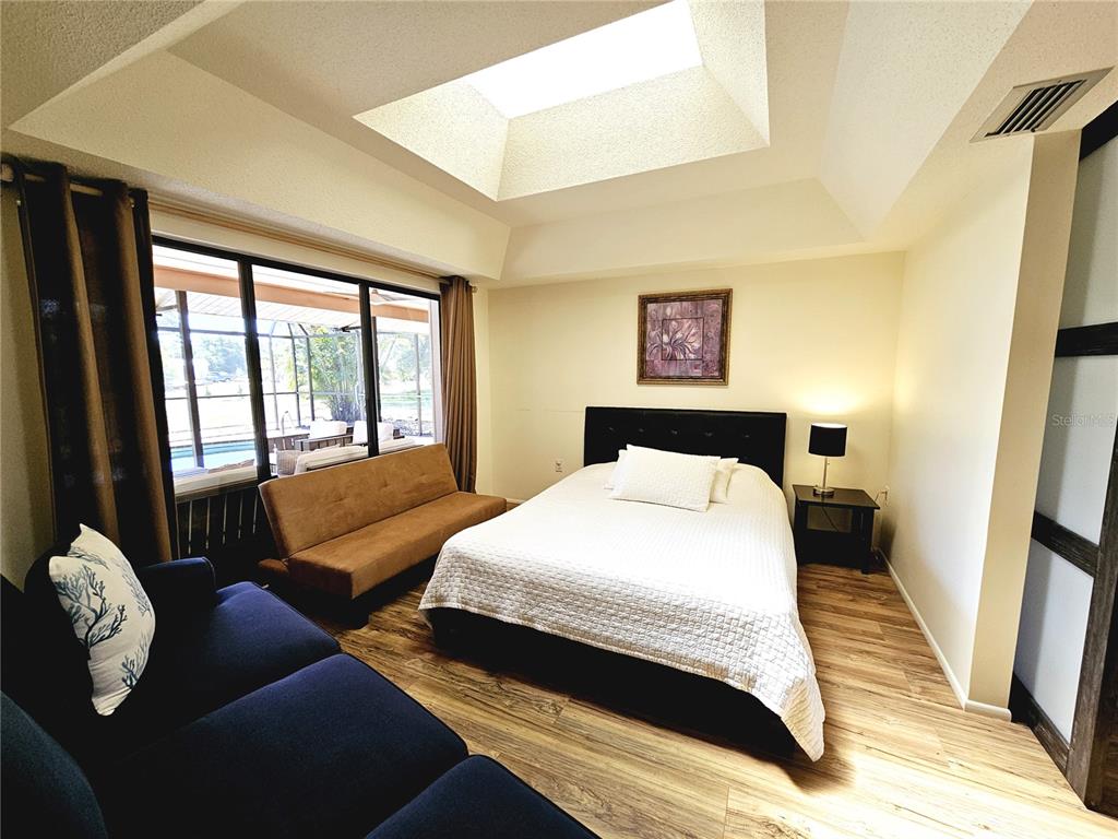 2411 Belle Road Englewood, FL 34223 - Photo 20 of 30 a bedroom with bed and a window