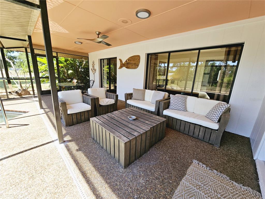 2411 Belle Road Englewood, FL 34223 - Photo 26 of 30 a living room with furniture and a large window