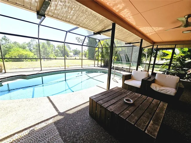 a view of a swimming pool with a porch