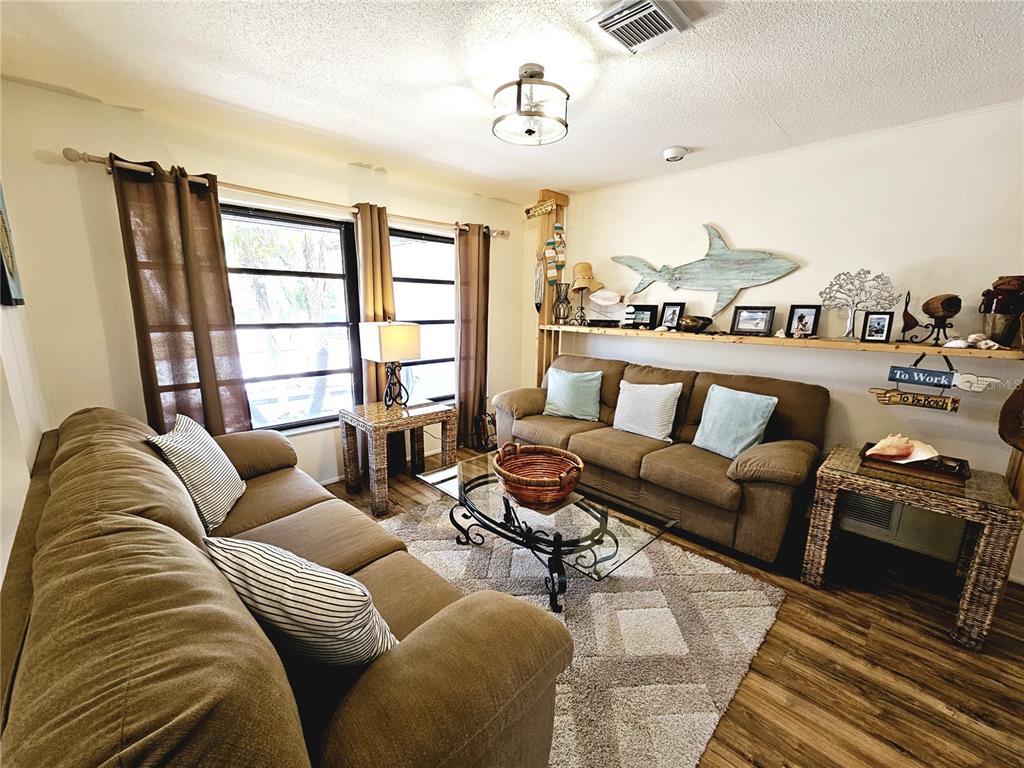 2411 Belle Road Englewood, FL 34223 - Photo 5 of 30 a living room with furniture and a large window