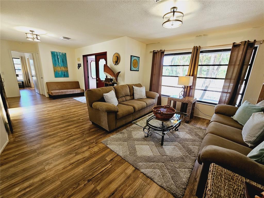 2411 Belle Road Englewood, FL 34223 - Photo 6 of 30 a living room with furniture or couch and a window