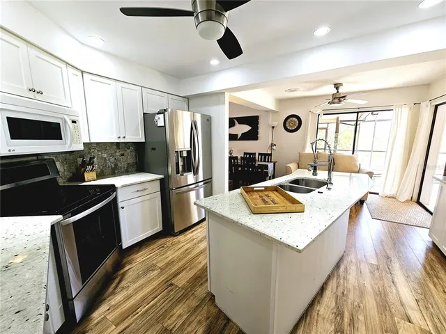 a living room with furniture or couch and a flat screen tv