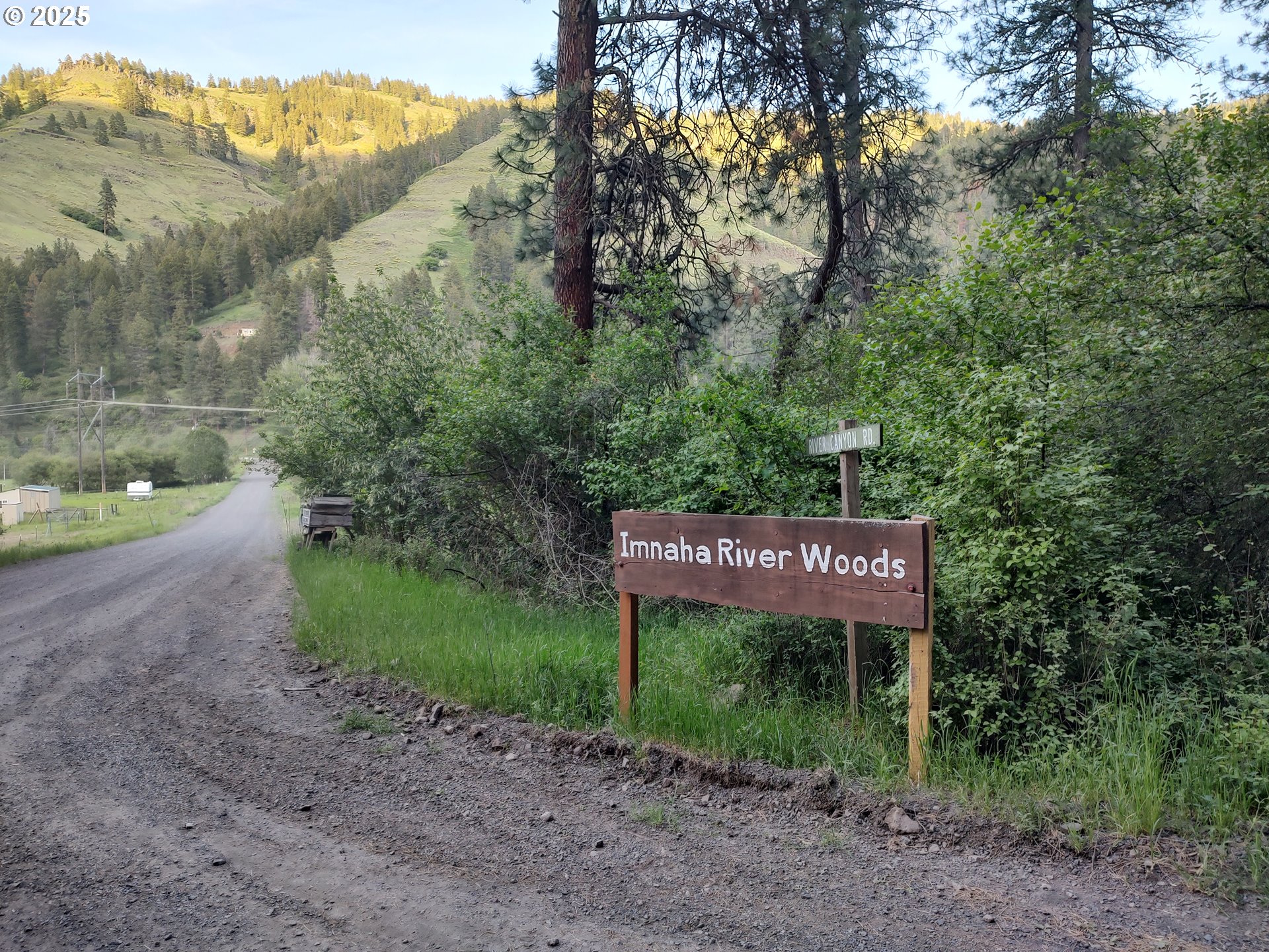 59831 River Canyon Road Imnaha, OR 97842 - Photo 3 of 9 a sign that is on the side of the road