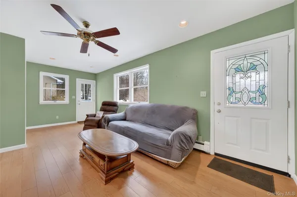 a living room with furniture and a window