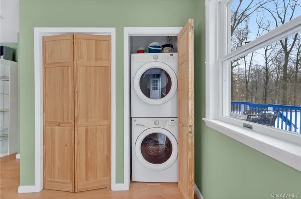 a view of a hallway with washer and dryer