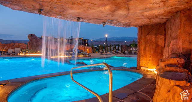 2331 Mesa Road, Unit E3 Moab, UT 84532 - Photo 3 of 71 Community pool with a hot tub, a patio area, and a mountain view