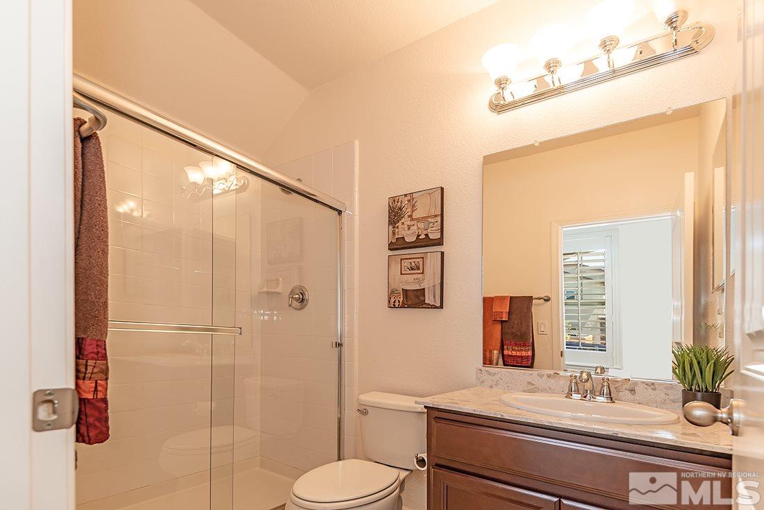2005 Bears Ranch Drive Reno, NV 89521 - Photo 9 of 23 a bathroom with a granite countertop sink toilet and shower