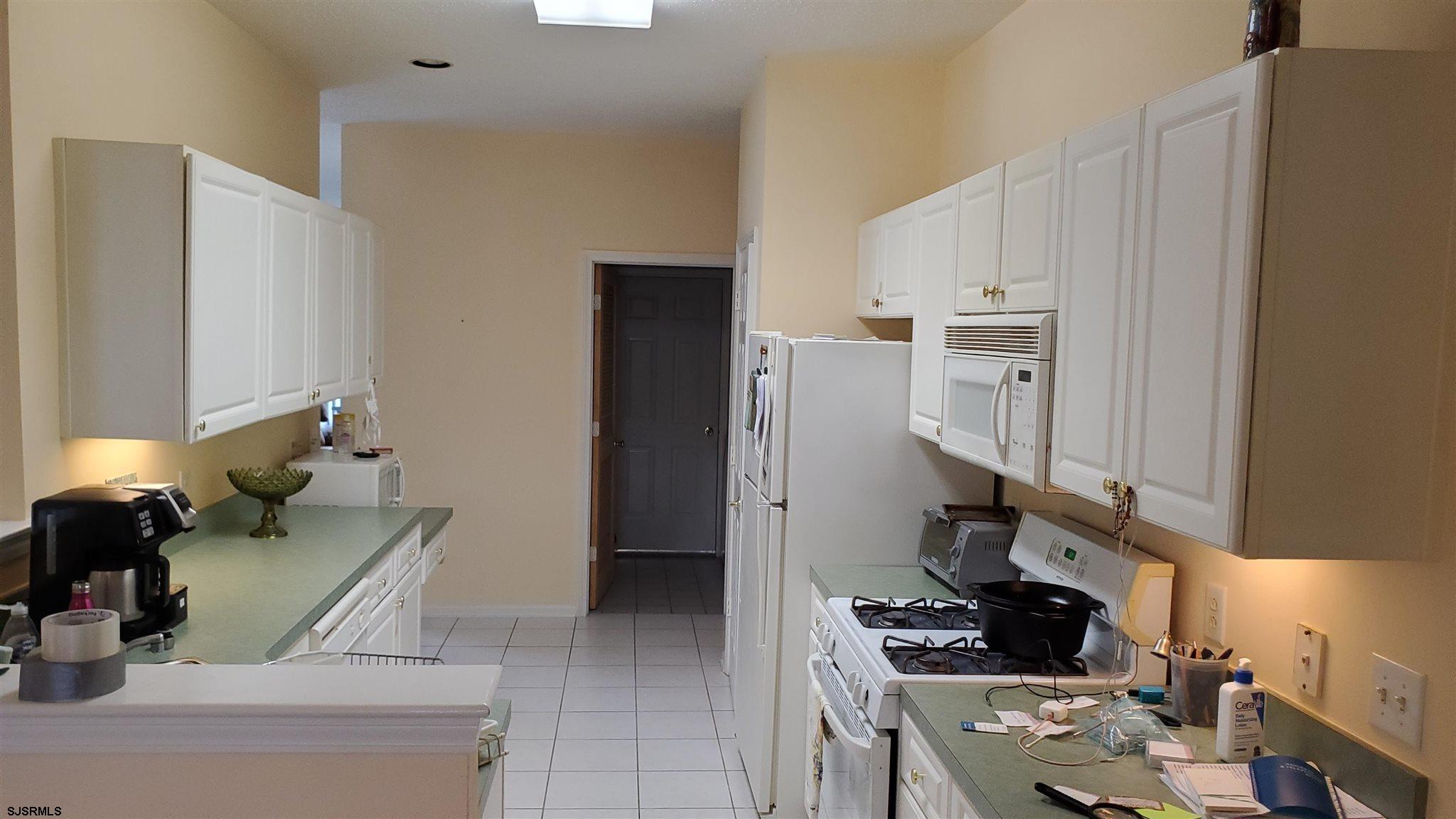 6 Quail Road Barnegat, NJ 08005 - Photo 6 of 9 a kitchen with stainless steel appliances kitchen island granite countertop a refrigerator and a stove