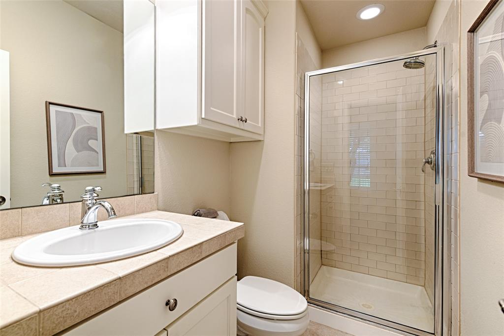 6269 Oram Street, Unit 10 Dallas, TX 75214 - Photo 5 of 25 a bathroom with a sink toilet and shower