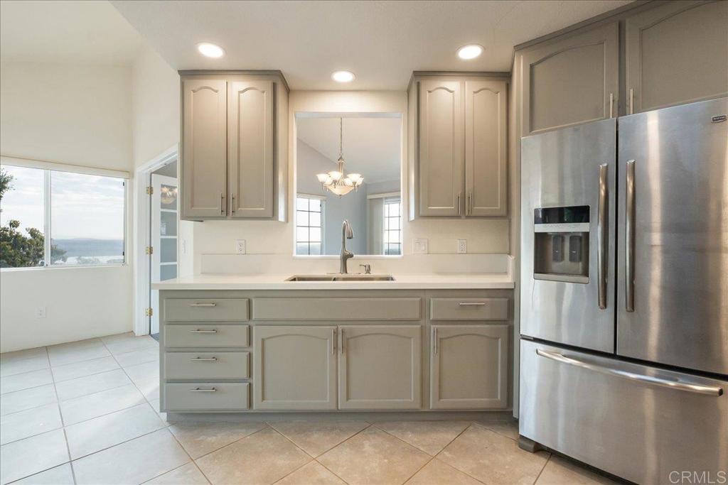 1617 Portola Avenue Spring Valley, CA 91977 - Photo 7 of 34 a kitchen with a refrigerator and a sink