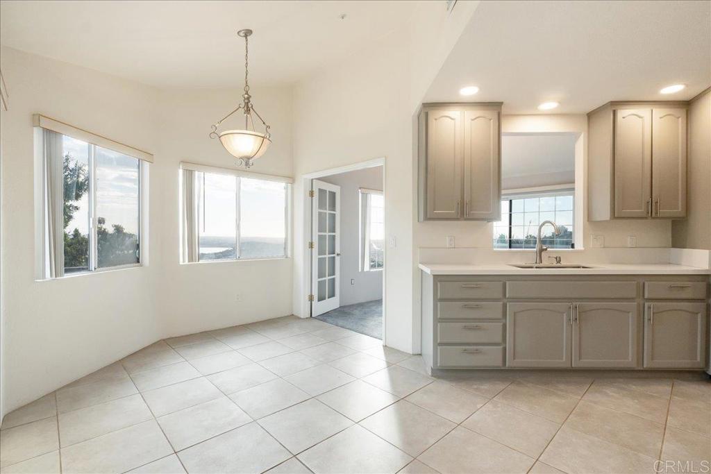 1617 Portola Avenue Spring Valley, CA 91977 - Photo 8 of 34 a bathroom with a sink a vanity and mirror