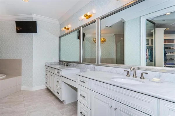 a bathroom with a bathtub and shower