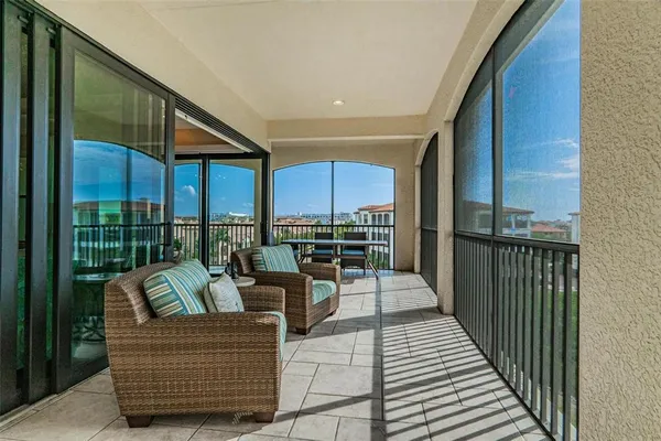a view of a backyard with plants and patio