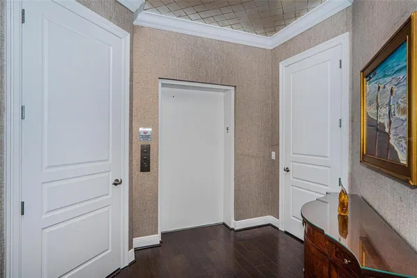 a view of an entryway with wooden floor