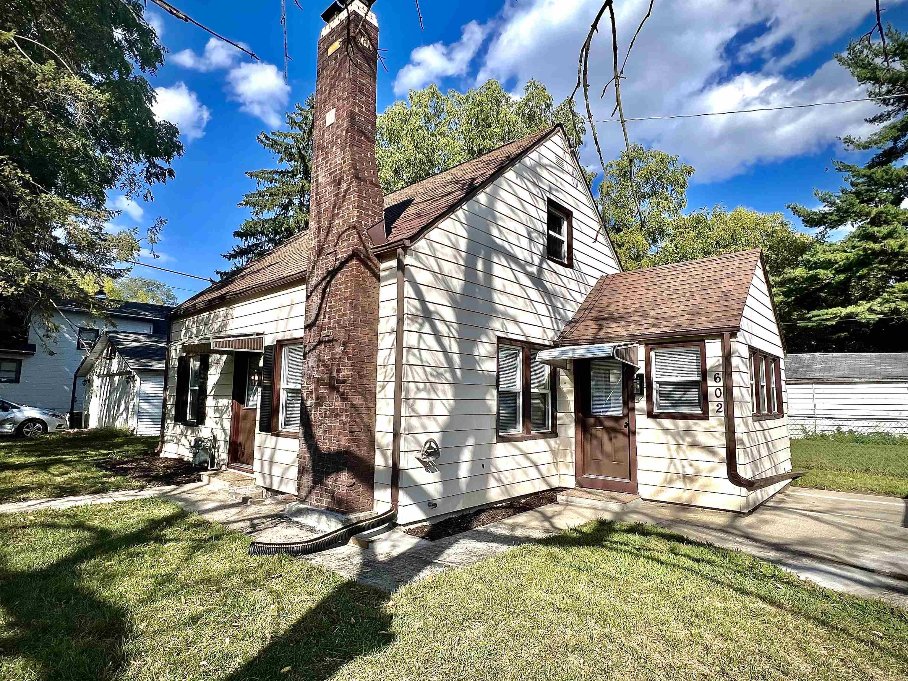 602 Barnum Road Rockford, IL 61109 - Photo 2 of 16 a view of a house with backyard and a tree
