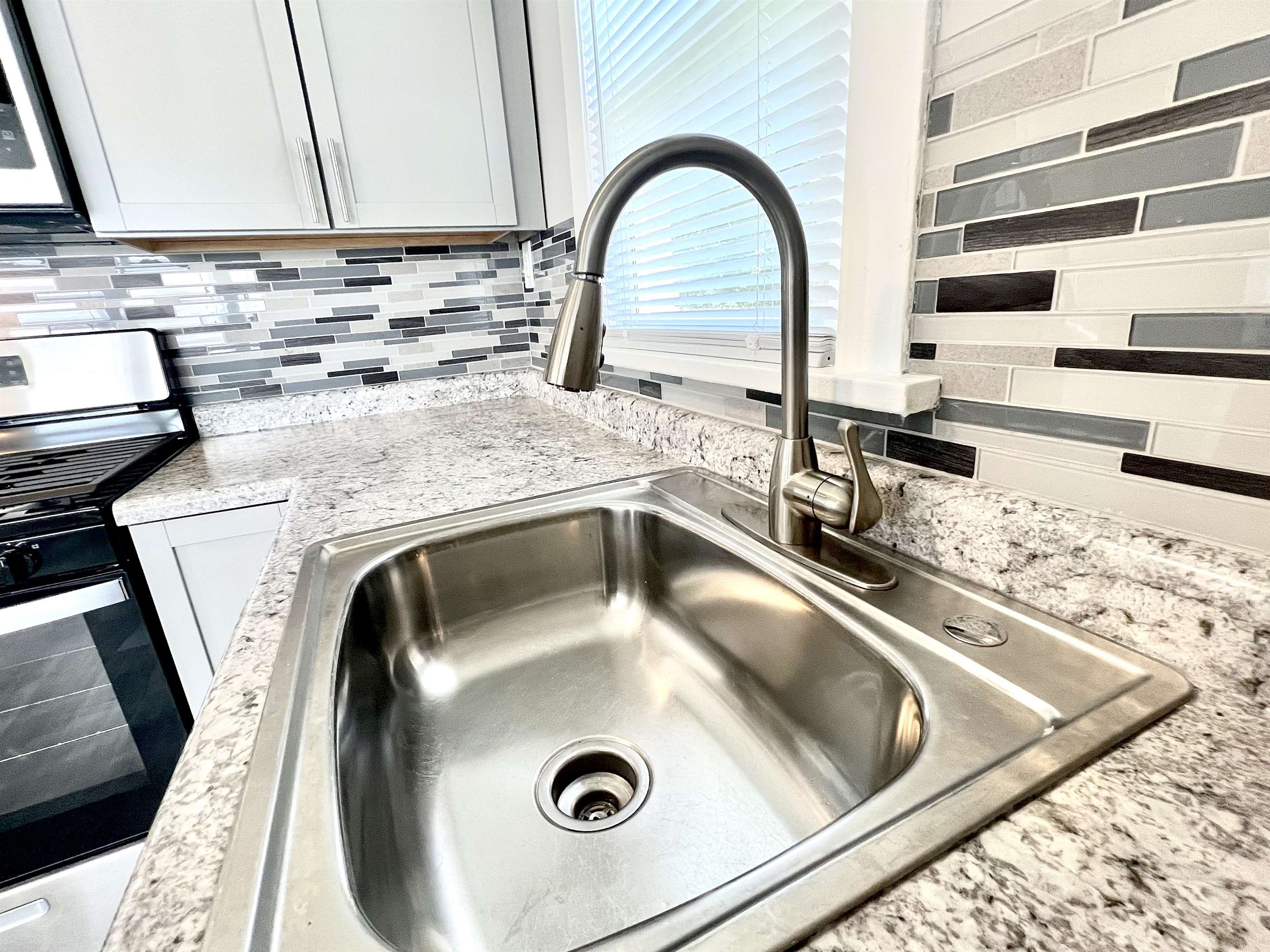 602 Barnum Road Rockford, IL 61109 - Photo 9 of 16 a close view of sink and tap
