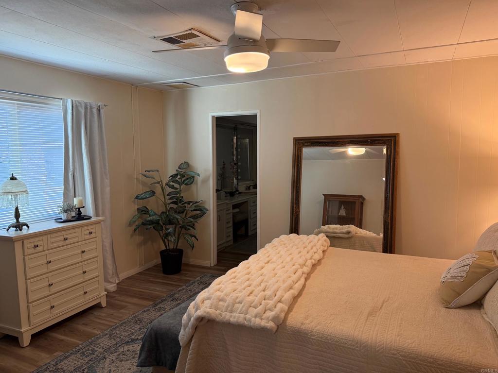 1010 Palm Canyon Drive, Unit 264 Borrego Springs, CA 92004 - Photo 19 of 50 a bedroom with a bed and a dresser