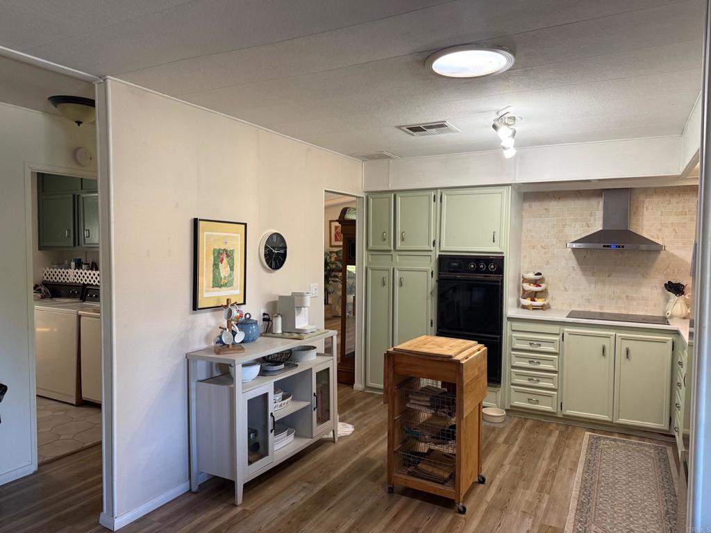 1010 Palm Canyon Drive, Unit 264 Borrego Springs, CA 92004 - Photo 21 of 50 a kitchen with stainless steel appliances a stove refrigerator sink and microwave