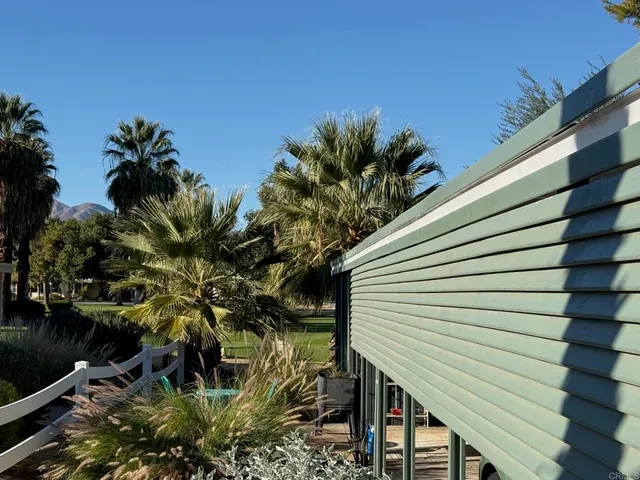 a view of a house with a tree